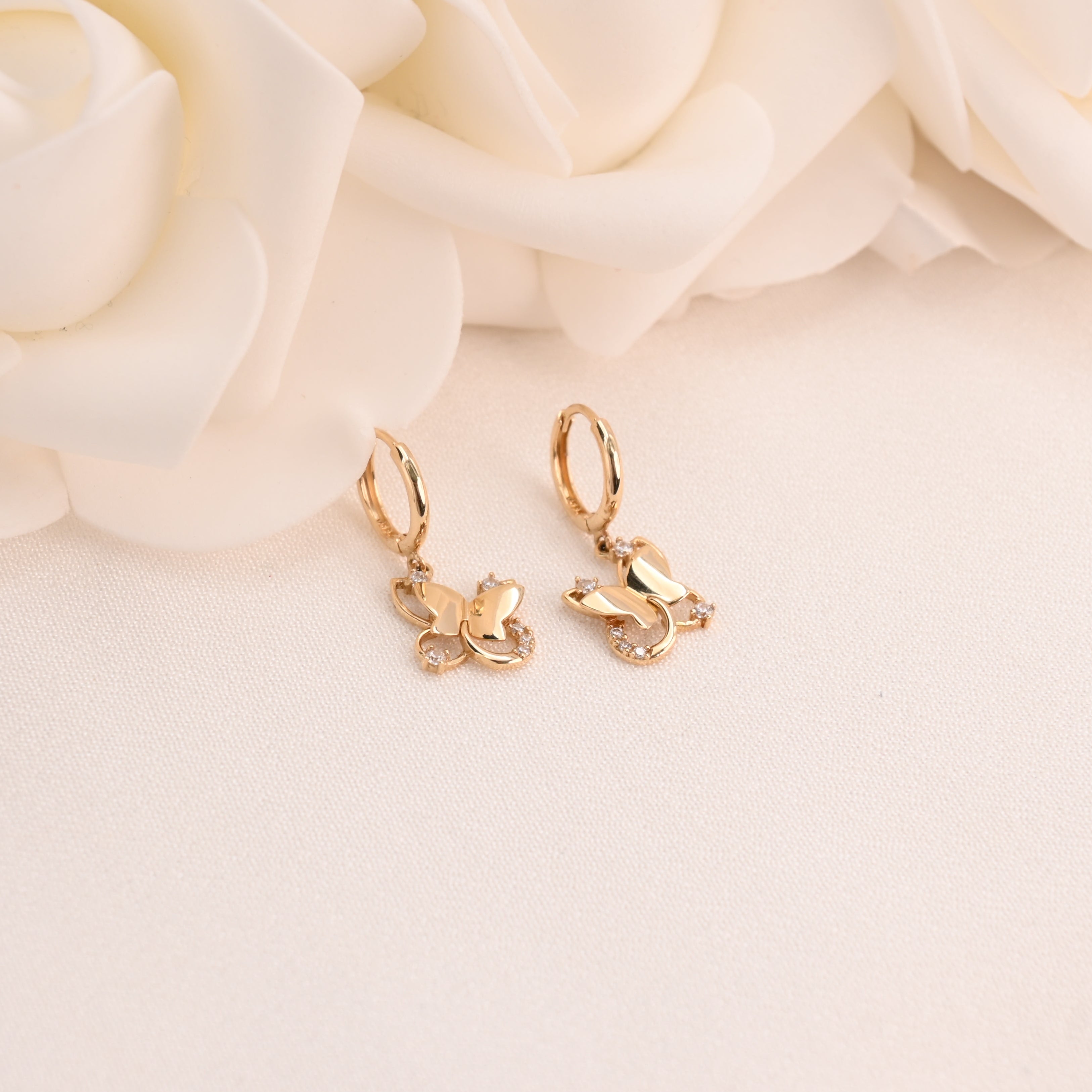 Pendientes Huggie de mariposa colgantes de oro macizo de 14 k (10 mm)