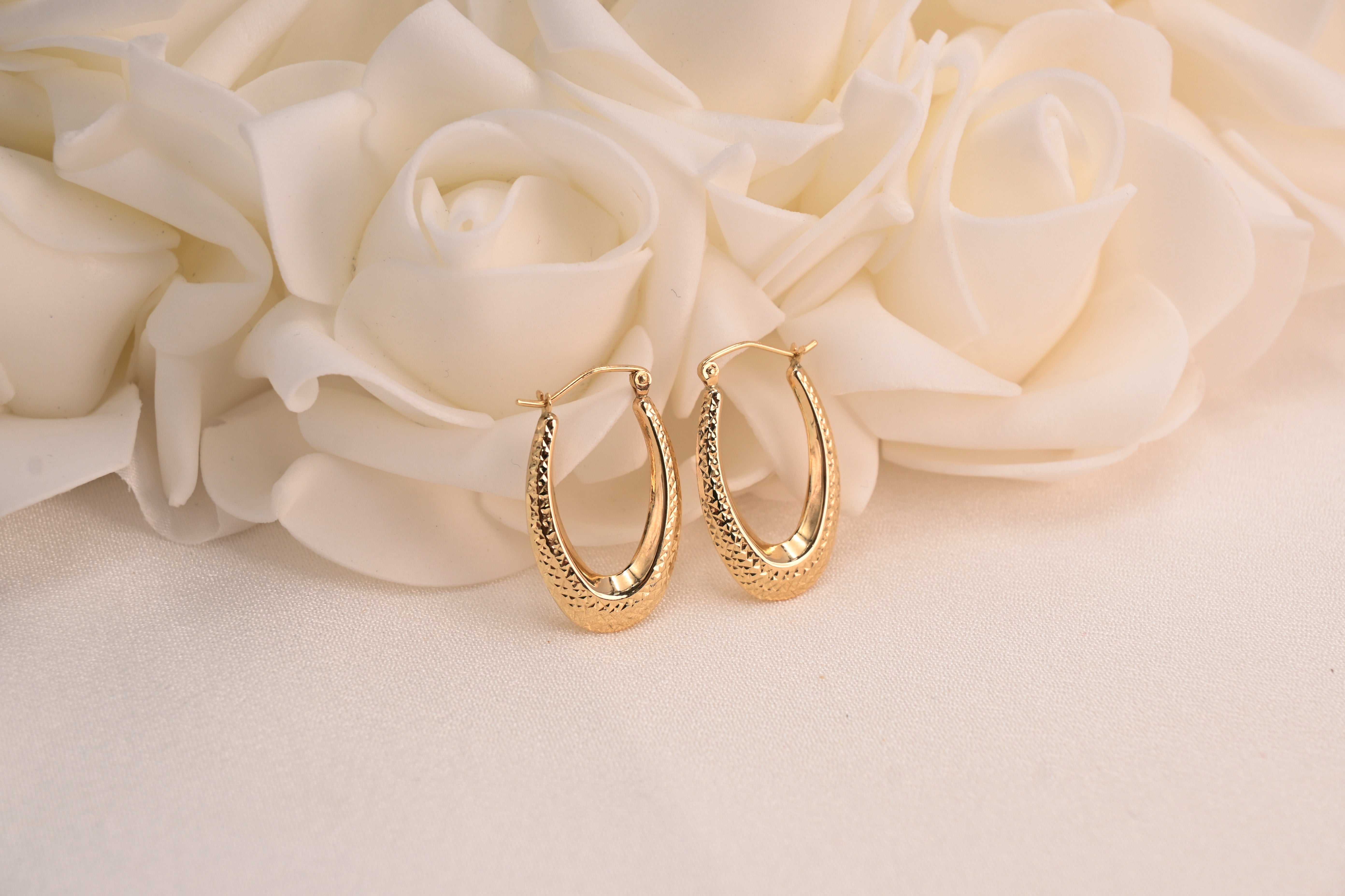 Beautiful 14k Gold Diamond Cut Oval Hoop Earrings