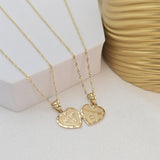 May include: Two gold heart-shaped necklaces with chains. One heart has the word &#39;MOM&#39; engraved on it and the other heart has the word &#39;DAD&#39; engraved on it.